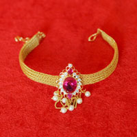 Traditional Baajubanda Ruby in gold forming